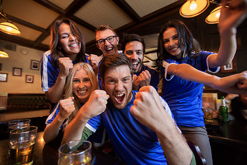 Image showing football fans or friends with beer at sport bar