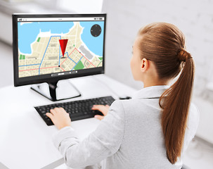 Image showing businesswoman with gps navigator map on computer