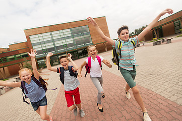 Image showing group of happy elementary school students running