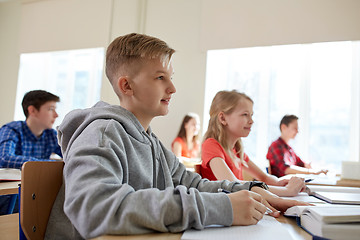 Image showing group of students with books at school lesson