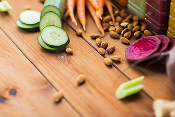 Image showing different vegetables and almond nuts on wood