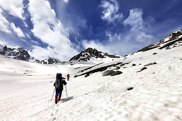 Image showing Two hikers in snow plateau
