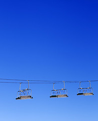 Image showing Ski-lift and blue clear sky