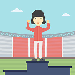 Image showing Sportswoman celebrating on the winners podium.