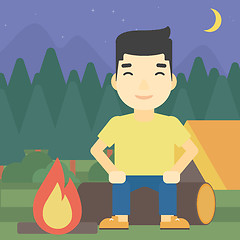 Image showing Man sitting on log in the camping.