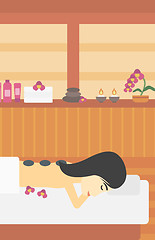 Image showing Woman getting stone therapy vector illustration.