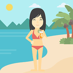 Image showing Woman with cocktail on the beach.