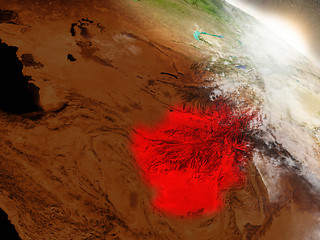 Image showing Afghanistan from space highlighted in red