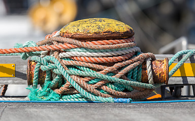 Image showing Metal bollard with ropes