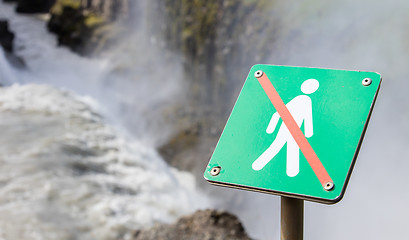 Image showing Forbidden to walk over here - Iceland - Fierce waterfall in back