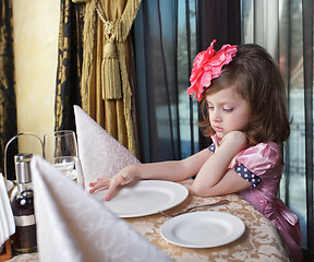 Image showing girl at the dinner table