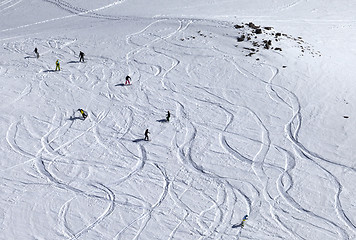 Image showing Snowboarder downhill on off piste slope with newly-fallen snow