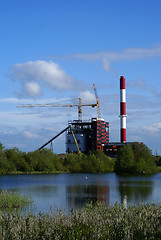 Image showing construction in industrial factory  with lake and blue sky on ba