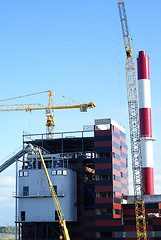 Image showing cranes and chinmey on construction of industrial factory