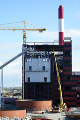 Image showing cranes and chinmey on construction of industrial factory