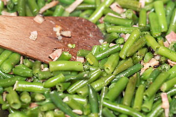 Image showing roasting fresh green beans with bacon