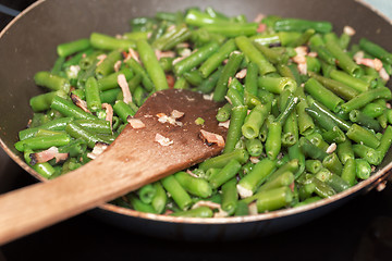 Image showing roasting fresh green beans with bacon