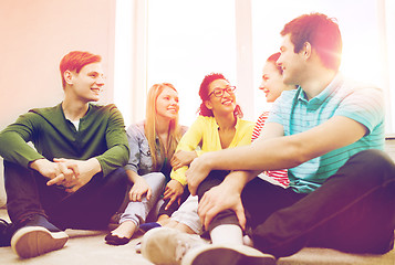 Image showing five smiling teenagers having fun at home