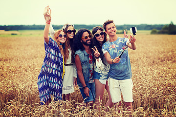 Image showing hippie friends with smartphone on selfie stick