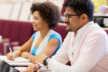 Image showing international students with notebooks on lecture