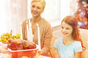 Image showing smiling family having holiday dinner at home