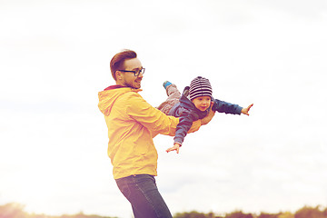 Image showing father with son playing and having fun outdoors