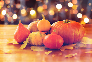 Image showing close up of halloween pumpkins on wooden table