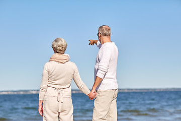 Image showing happy senior couple on summer beach