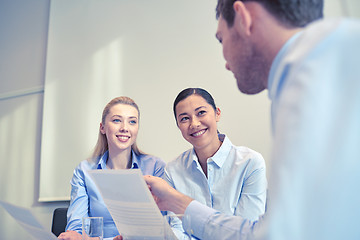 Image showing group of smiling businesspeople meeting in office