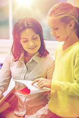 Image showing school girl with notebook and teacher in classroom