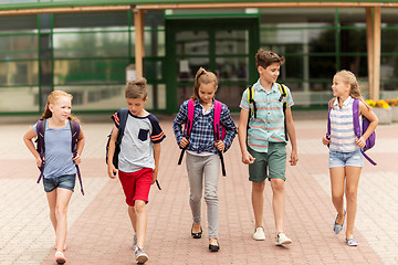 Image showing group of happy elementary school students walking