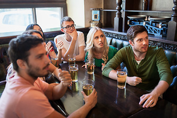 Image showing friends with beer watching football at bar or pub