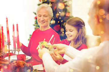 Image showing smiling family having holiday dinner at home