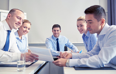 Image showing group of smiling businesspeople meeting in office