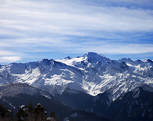 Image showing Sunlight snowy mountains and cloudy sky