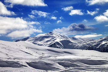 Image showing Ski slope and beautiful sky with clouds in sun evening