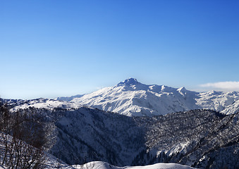 Image showing View on snowy mountains and blue sky in sunny morning