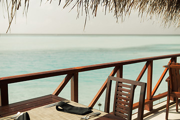 Image showing outdoor restaurant terrace with furniture over sea