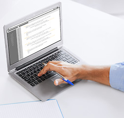 Image showing businessman with laptop computer working at office