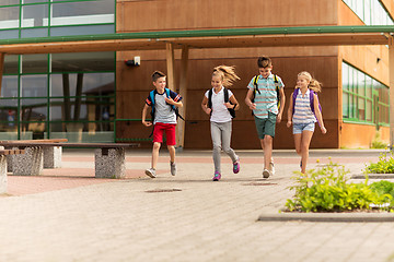 Image showing group of happy elementary school students running