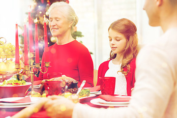 Image showing smiling family having holiday dinner at home