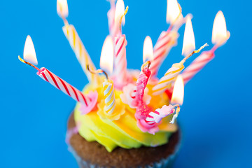 Image showing birthday cupcake with many burning candles