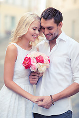 Image showing couple with flowers in the city