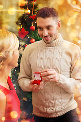 Image showing romantic man proposing to a woman