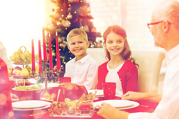 Image showing smiling family having holiday dinner at home