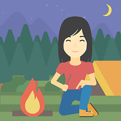 Image showing Woman kindling campfire vector illustration.