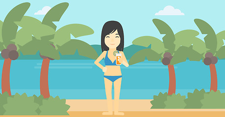 Image showing Woman with cocktail on the beach.