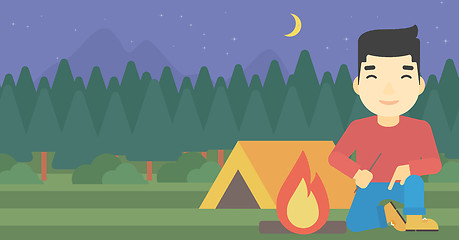 Image showing Man kindling campfire vector illustration.