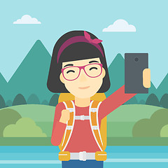 Image showing Woman with backpack making selfie.