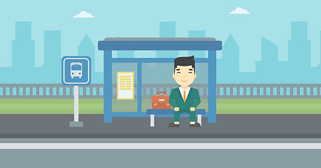 Image showing Man waiting for bus at the bus stop.